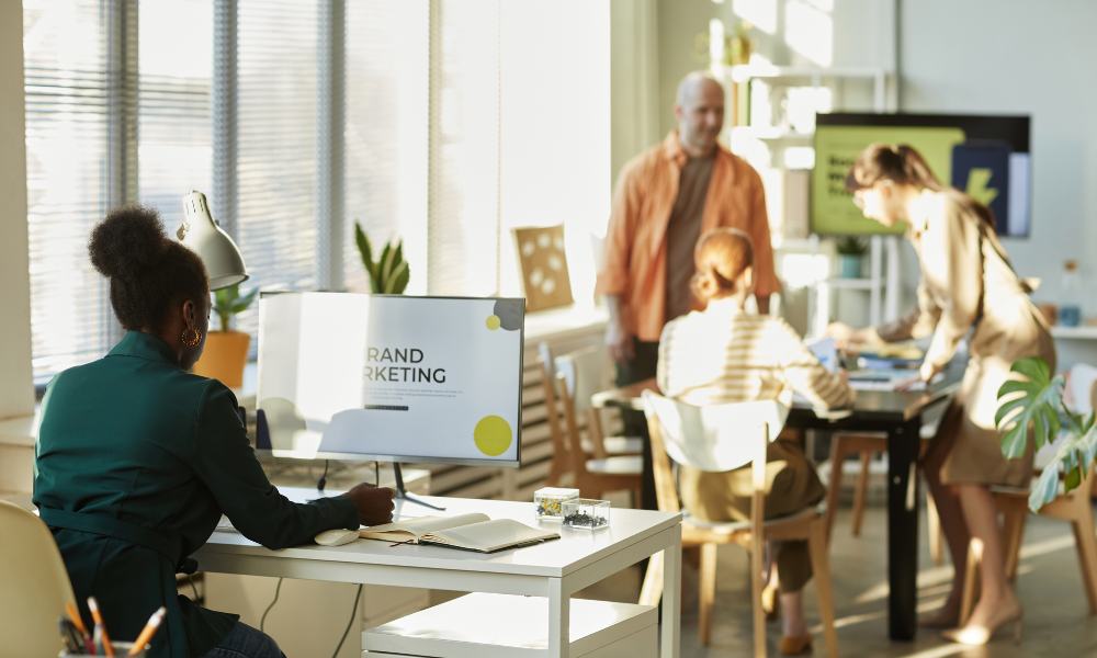 Employee in a modern office working on marketing presentation
