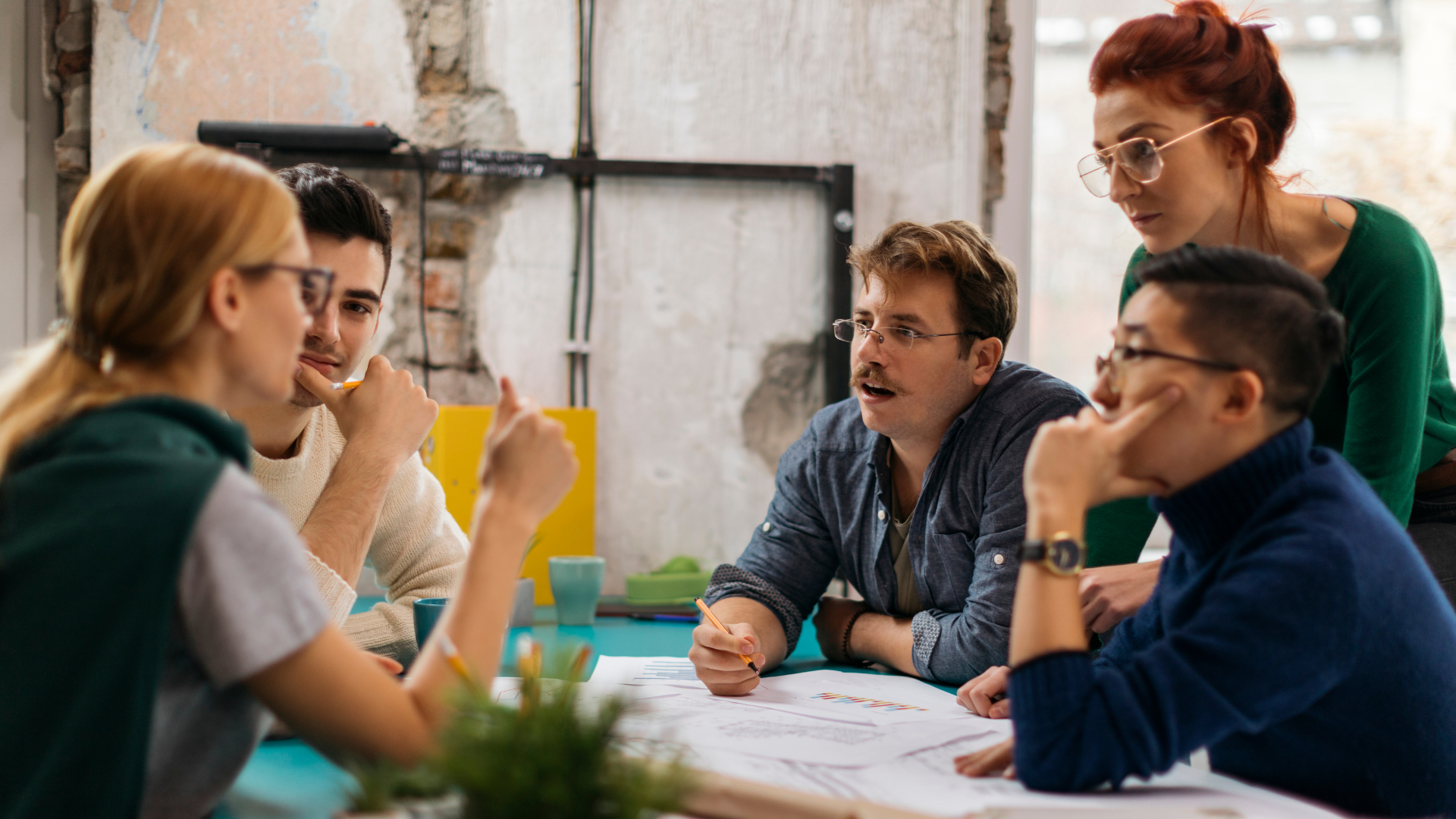 Team looking through a Inclusive Language Guide